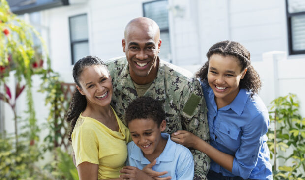 A family in front of their home